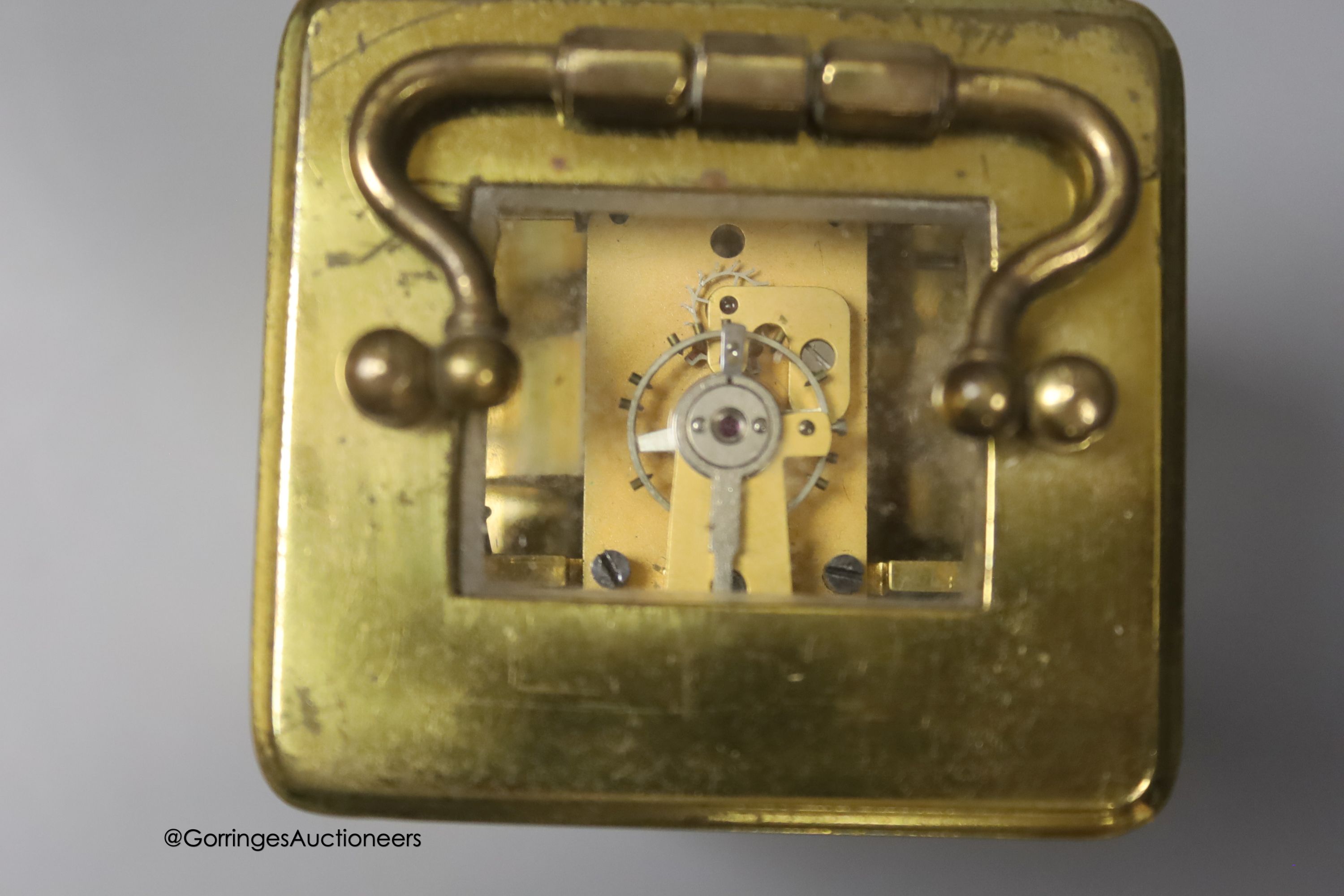 A brass cased carriage timepiece, 7.5cm, in a leather carrying case